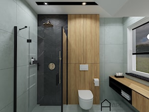 Łazienka z betonowymi płytkami, drewnianymi okładzinami i złotymi elementami - zdjęcie od APE wnętrza
