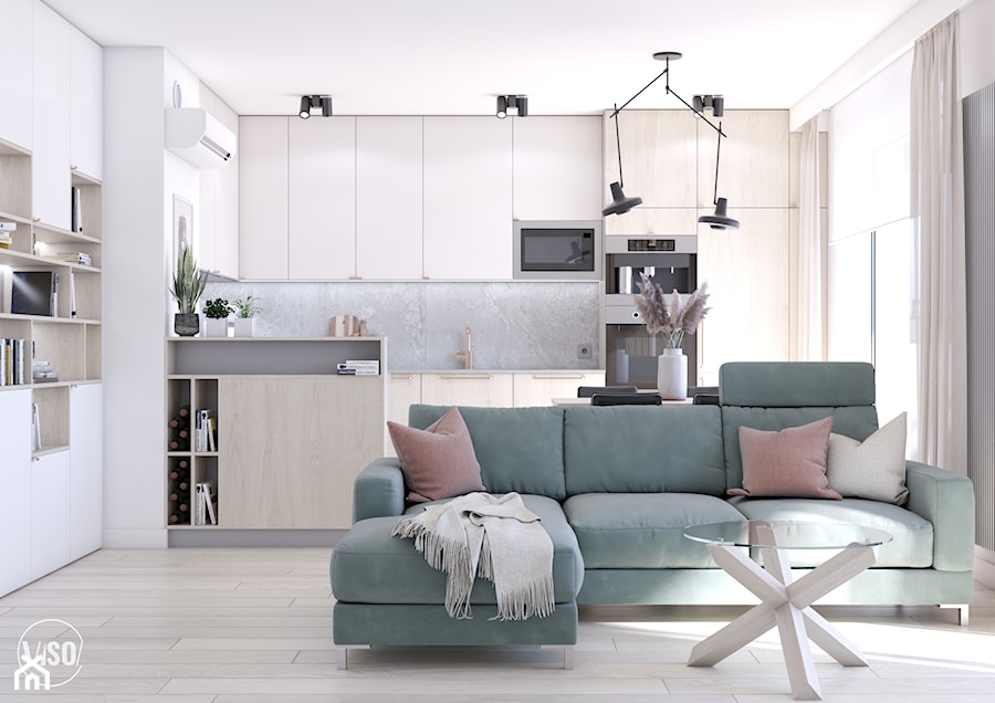Salon z aneksem kuchennym, zielona sofa, szklany stolik, drewniana podłoga - zdjęcie od VISO Pracownia Projektowa