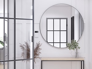 Wiatrołap z okrągłym lustrem i konsolą, drzwi loftowe do dalszej część domu - zdjęcie od VISO Pracownia Projektowa