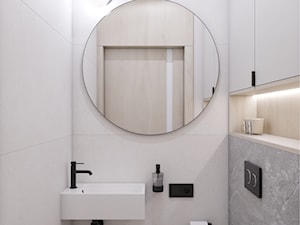 Jasne WC z okrągłym lustrem i czarnymi dodatkami - zdjęcie od VISO Pracownia Projektowa