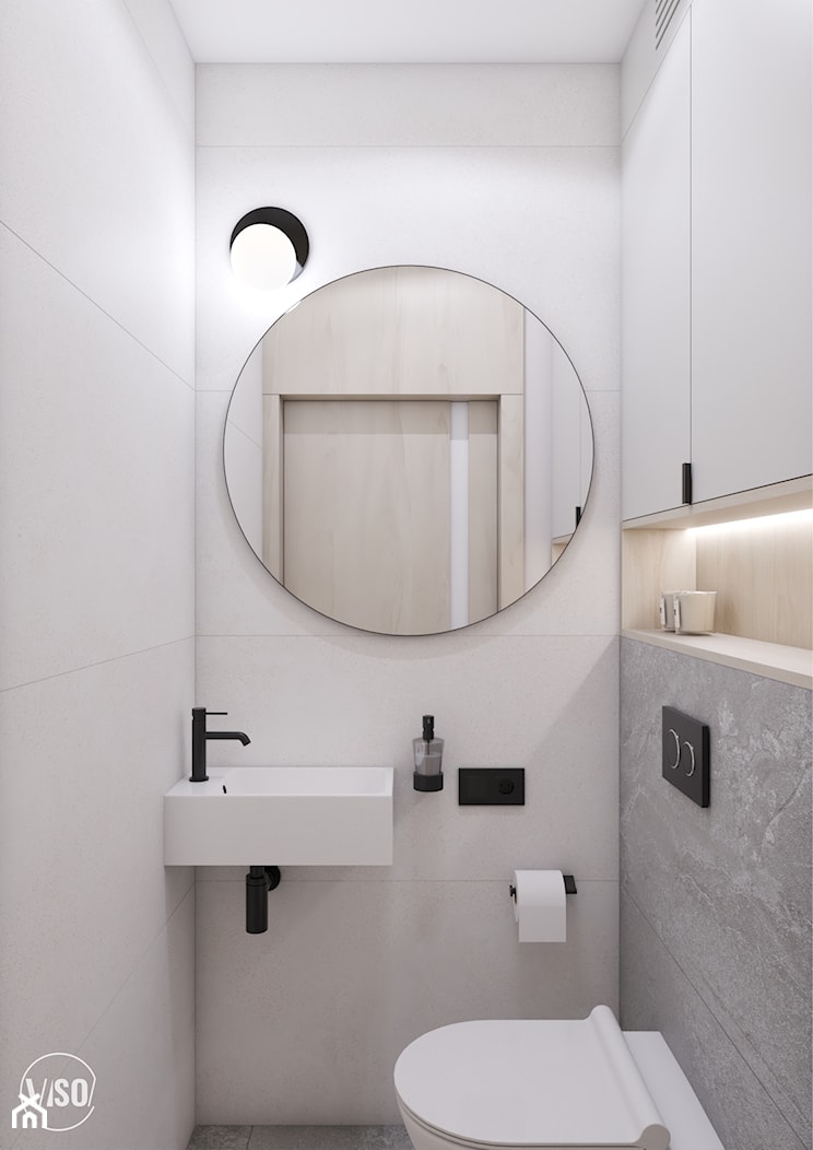 Jasne WC z okrągłym lustrem i czarnymi dodatkami - zdjęcie od VISO Pracownia Projektowa - Homebook