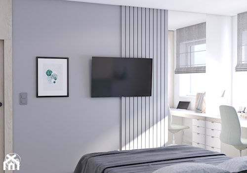 Sypialnia z zielonym tapicerowanym łóżkiem, toaletką i TV - zdjęcie od VISO Pracownia Projektowa
