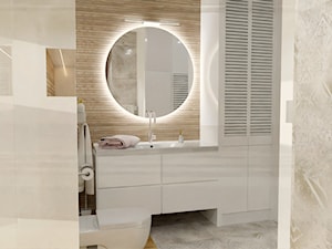 Jasna łazienka z okrągłym lustrem. - zdjęcie od LINIA WNĘTRZ - PROJEKTOWANIE WNĘTRZ DOMÓW I MIESZKAŃ