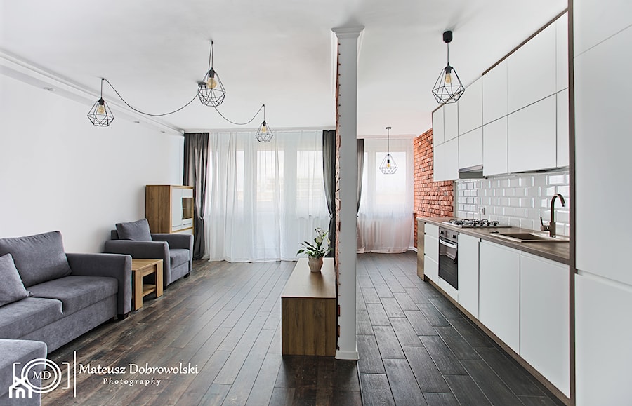 mieszkanie w stylu industrialnym kuchnia i salon - zdjęcie od Mateusz Dobrowolski Fotografia