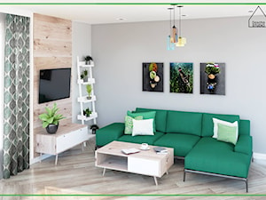Salon z zieloną sofą dla pasjonatów roślin - zdjęcie od Doscha STUDIO Julia Chalimoniuk-Dombrowska Projektowanie Wnętrz Gdynia
