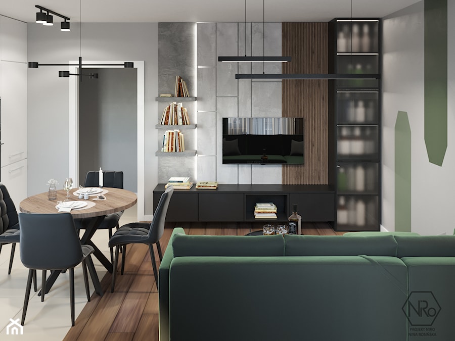 mały salon z kuchnią z jadalnią oraz ze ścianką telewizyjną w odcieniu butelkowej zieleni - zdjęcie od Projekt NiRo