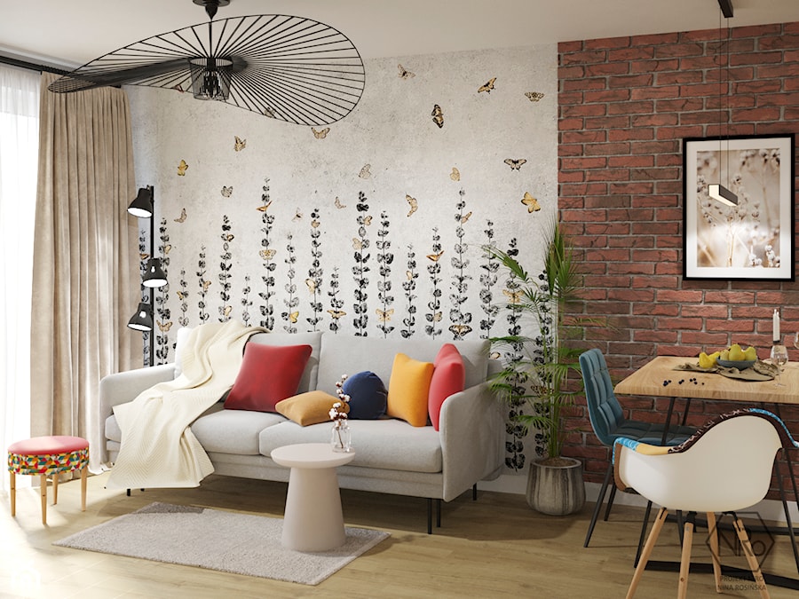 salon industrialny z rozkładaną sofą, tapetą wonderwall i cegłą - zdjęcie od Projekt NiRo