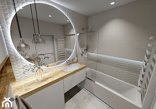 Jasna łazienka z dużym okrągłym lustrem - zdjęcie od Qualita Interno