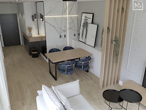 Jasny, przytulny salon z dużą ilością drewna i bieli w mieszkaniu w Zabrzu - zdjęcie od STUDIO MILIMETR