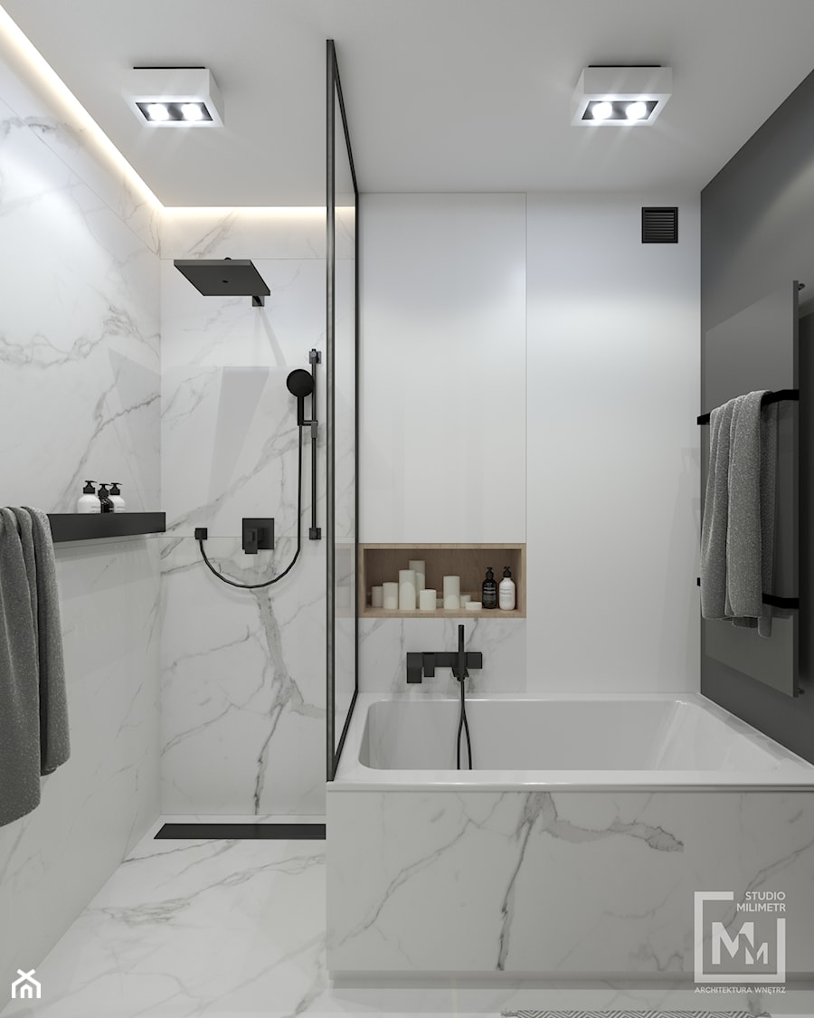Łazienka z marmurowymi płytkami w mieszkaniu w Zabrzu - zdjęcie od STUDIO MILIMETR