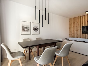 Realizacja Nowoczesny Minimalizm - Duża szara jadalnia w salonie - zdjęcie od DISENO INTERIORS - Apartamenty PREMIUM