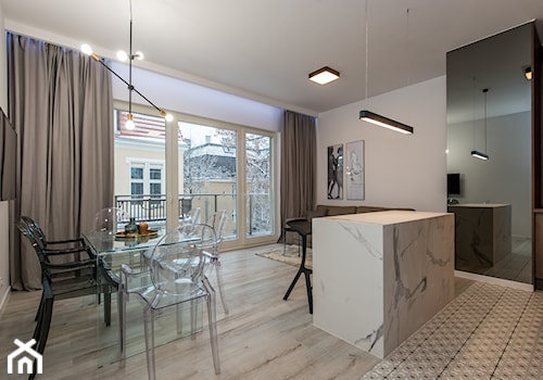 Eleganski Minimalizm - Realizacja - Duża szara jadalnia w salonie w kuchni - zdjęcie od DISENO INTERIORS - Apartamenty PREMIUM