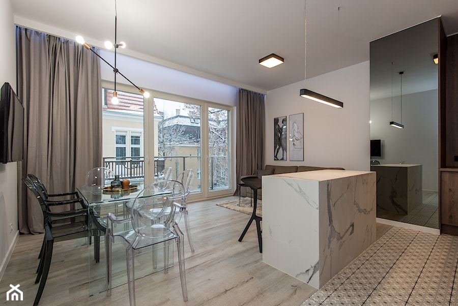 Eleganski Minimalizm - Realizacja - Duża szara jadalnia w salonie w kuchni - zdjęcie od DISENO INTERIORS - Apartamenty PREMIUM