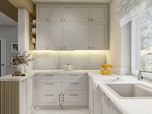 Ujęcie na kuchnie w ciepłych barwach - zdjęcie od Honest Studio projektowanie wnętrz