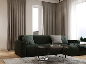 Szaro-beżowy salon z narożnikiem w kolorze butelkowej zieleni oraz czarne akcenty. - zdjęcie od VILAR Interiors