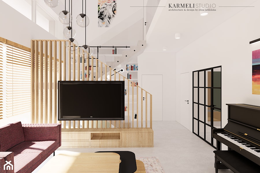 Salon z betonową podłogą i drewnianą zabudową RTV z lameli - zdjęcie od Karmeli Studio