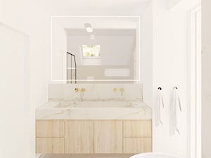 Jasna łazienka z umywalką z kamienia i lustrem LED - zdjęcie od Karmeli Studio