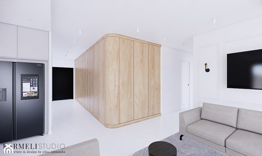 Salon z betonową podłogą i drewnianą ścianą - zdjęcie od Karmeli Studio
