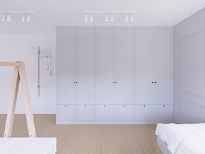 Sypialnia dla dwóch chłopców z dużą szafą i sztukaterią - zdjęcie od Karmeli Studio