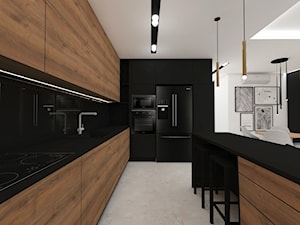 Nowoczesne mieszkanie/ aneks kuchenny kuchnia/ czarny blat drewniane fronty lamele - zdjęcie od SZTUKA i WNĘTRZA