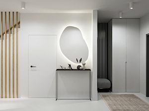 Minimalistyczna przestrzeń, wypełniona domowym ciepłem - Duży z zabudową meblową z nieregularnym lustrem biały szary z lustrem na ścianie z farbą na ścianie z lamelami na ścianie z drzwiami bezprzylgowymi z gładkimi drzwiami hol / przedpokój, styl m ... - zdjęcie od Lume design studio