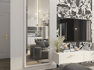 Elegancki salon ze sztukaterią, fazowanymi lustrami oraz złotymi dodatkami - zdjęcie od Elited Interior Design