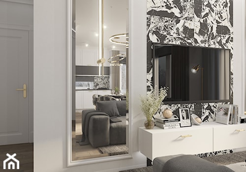 Elegancki salon ze sztukaterią, fazowanymi lustrami oraz złotymi dodatkami - zdjęcie od Elited Interior Design