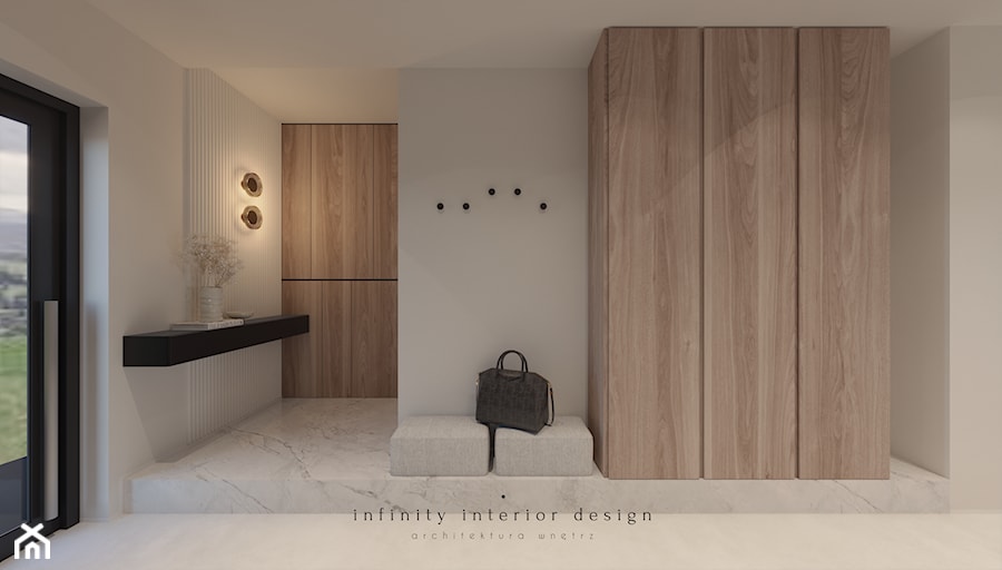 Przedpokój z dużą szafą i siedziskiem - zdjęcie od Infinity Interior Design