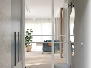 Białe metalowe drzwi z przeszkleniem w wiatrołapie - zdjęcie od Projekty Wnętrz | NIUANS STUDIO
