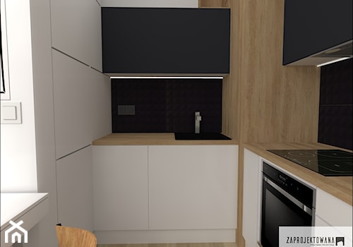 kawalerka - Mała zamknięta biała czarna z podblatowym zlewozmywakiem kuchnia w kształcie litery l, styl nowoczesny - zdjęcie od ZAPROJEKTOWANA