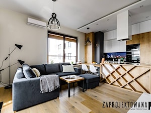 Apartament w stylu skandynawskim - Średni szary salon z kuchnią z jadalnią, styl nowoczesny - zdjęcie od ZAPROJEKTOWANA