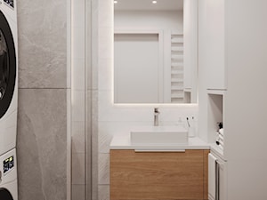 Mała łazienka podświetlanym lustrem | Mieszkanie w Krzeszowicach - zdjęcie od arch. Anna Życka