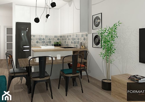 Mieszkanie ludzi z pasją - Mała otwarta z salonem szara z zabudowaną lodówką z nablatowym zlewozmywakiem kuchnia w kształcie litery u, styl industrialny - zdjęcie od Studio FORMAT HOME