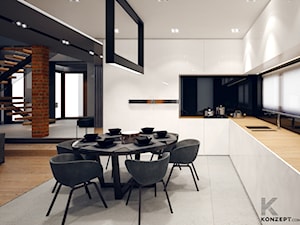Masłomiąca - Duża otwarta z salonem czarna z zabudowaną lodówką kuchnia w kształcie litery l, styl minimalistyczny - zdjęcie od KONZEPT Architekci