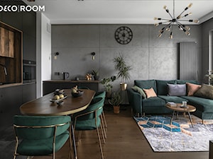 Salon ze ścianą imitującą beton - zdjęcie od Pracownia Architektury Wnętrz Decoroom