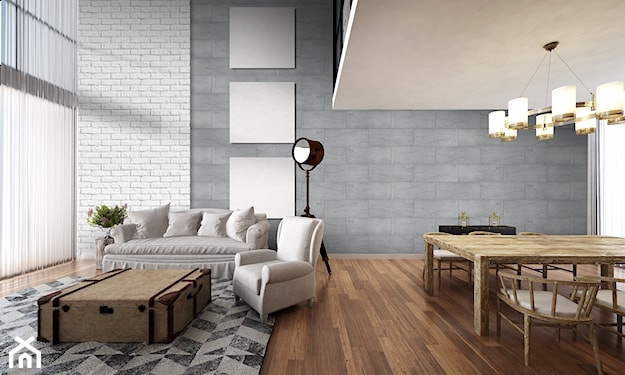 ściana z szarego kamienia, biała sofa, biały fotel, czarny reflektor podłogowy, podłoga z ciemnego drewna