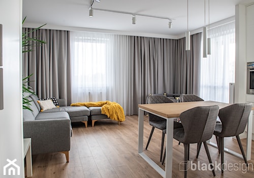 Białystok Mieszkanie 67 m2 - Średni biały szary salon z kuchnią z jadalnią, styl skandynawski - zdjęcie od black design