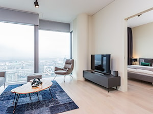 Apartament w Warszawie/Cosmopolitan - Średni biały salon, styl nowoczesny - zdjęcie od Michał Młynarczyk - Fotografia wnętrz