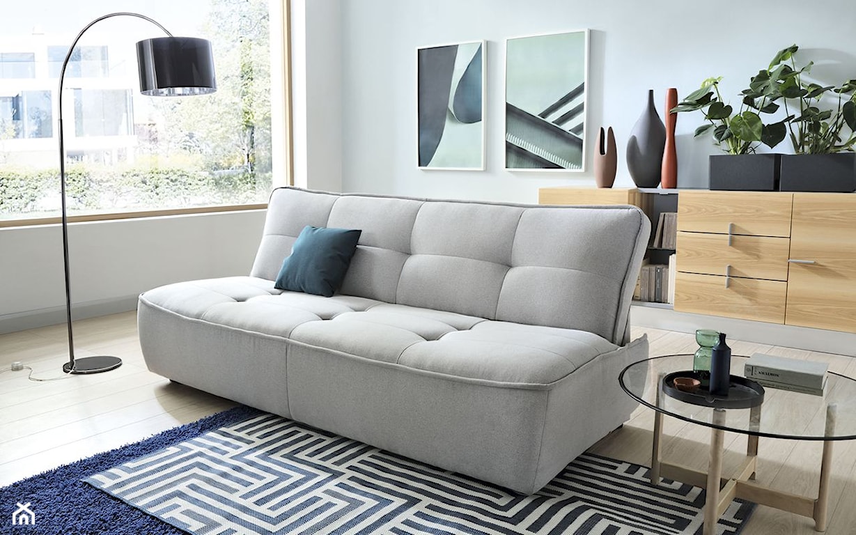 Kompaktowa sofa Nomo z funkcją spania C.S.T., z szeroką dekoracyjną kedrą, zaprojektowana w stylu Young