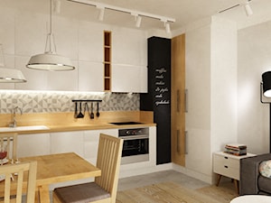 Mieszkanie na Woli Warszawa 54m2 - Mała otwarta z salonem biała z zabudowaną lodówką kuchnia w kształcie litery l, styl skandynawski - zdjęcie od Grafika i Projekt architektura wnętrz