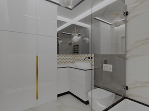 Czarno biała, elegancka łazienka + złoto - zdjęcie od MONOdizajn Architektura i Wnętrza