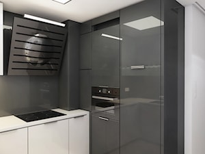 Mały Apartament - Mała otwarta z kamiennym blatem biała czarna z zabudowaną lodówką kuchnia w kształcie litery u, styl nowoczesny - zdjęcie od Manufaktura Projektów