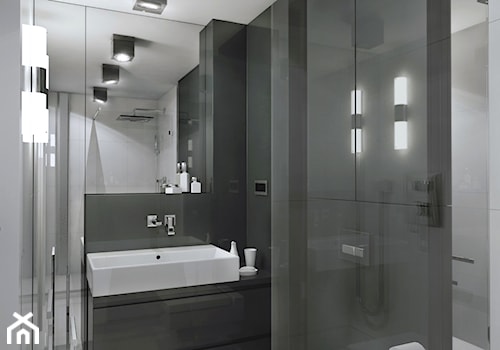 Mały Apartament - Mała bez okna z lustrem z punktowym oświetleniem łazienka, styl nowoczesny - zdjęcie od Manufaktura Projektów