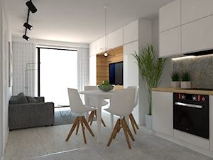 Mieszkanie Mokotów - Mały biały salon z kuchnią z jadalnią z tarasem / balkonem, styl nowoczesny - zdjęcie od INTERNOO/studio architektury