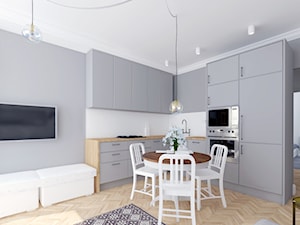 Jednolity - Mała z salonem biała szara z zabudowaną lodówką kuchnia w kształcie litery l, styl skandynawski - zdjęcie od Miliform