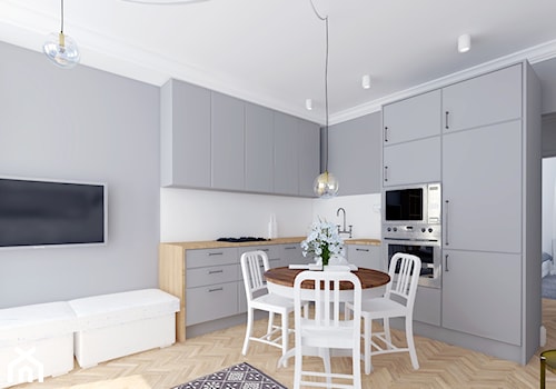 Jednolity - Mała z salonem biała szara z zabudowaną lodówką kuchnia w kształcie litery l, styl skandynawski - zdjęcie od Miliform