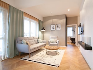 Mieszkanie 60m2 - Średni beżowy szary salon z tarasem / balkonem, styl skandynawski - zdjęcie od Projekt Kolektyw