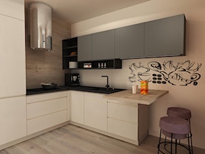 Kawalerka - Średnia otwarta beżowa z zabudowaną lodówką kuchnia w kształcie litery l, styl nowoczesny - zdjęcie od arek570