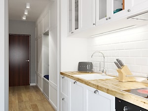 MIESZKANIE 49,5M² – POZNAŃ - Mała otwarta z salonem biała z zabudowaną lodówką z nablatowym zlewozmywakiem kuchnia jednorzędowa, styl rustykalny - zdjęcie od Devangari Design