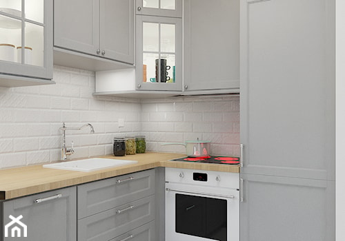 KAWALERKA 32M² – KAMIONEK - Mała otwarta biała z zabudowaną lodówką z nablatowym zlewozmywakiem kuchnia w kształcie litery l, styl rustykalny - zdjęcie od Devangari Design